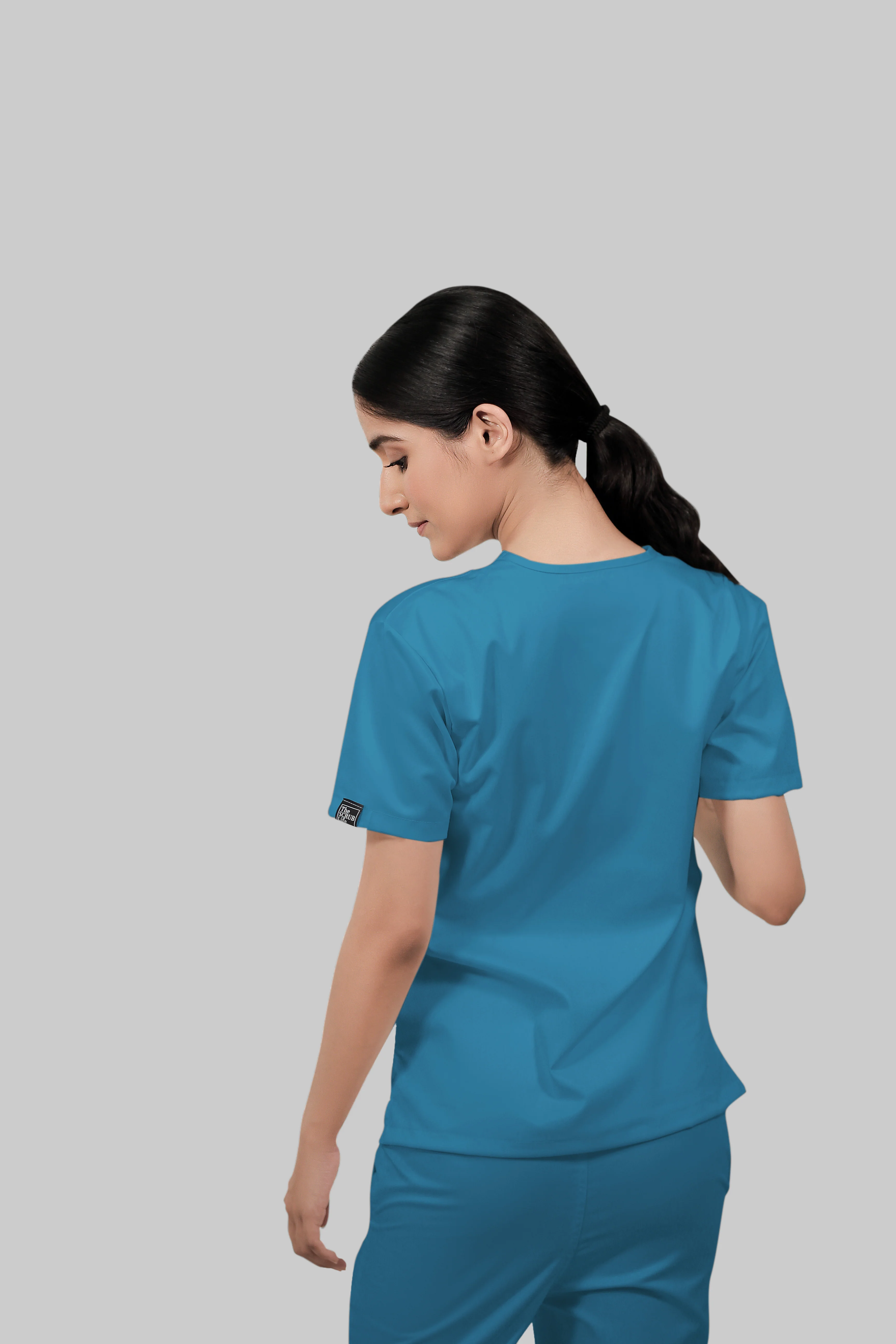 Stretchable (2Way) Women Peacock Blue V-Neck With Straight Pant Scrub Set - Image 3
