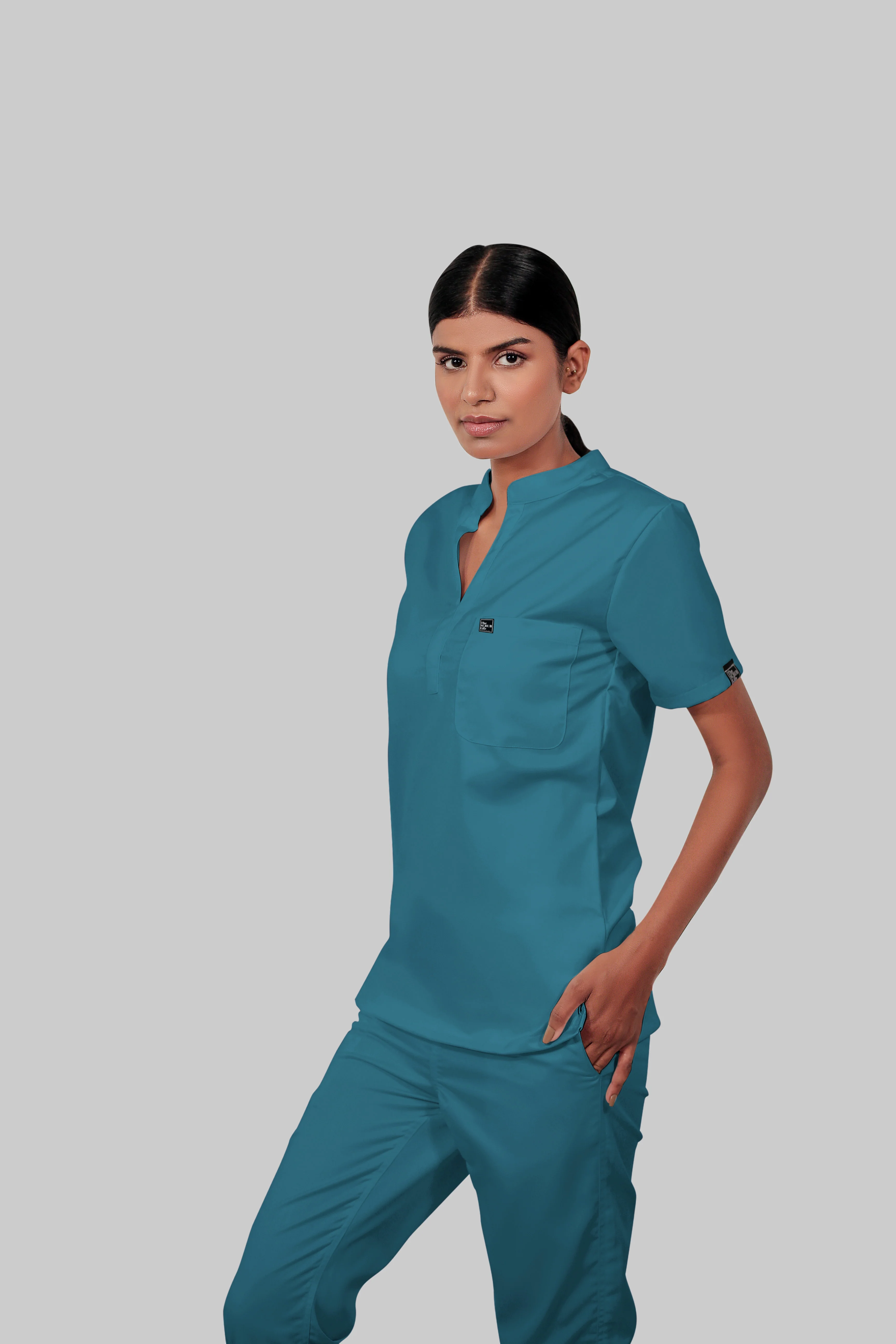 Stretchable (4Way) Women Peacock Blue Mandarin Neck With Jogger Scrub Set - Image 4
