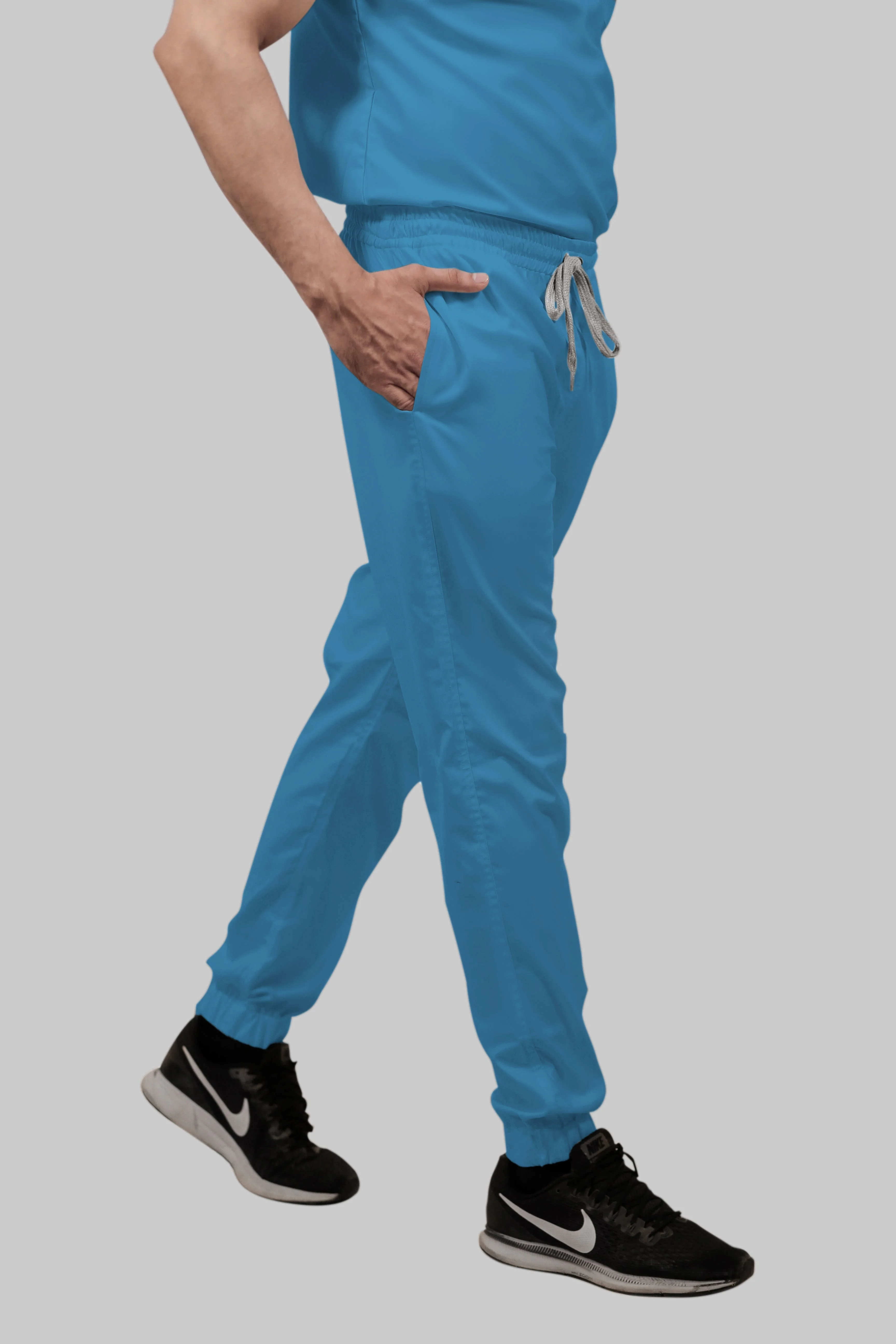 Stretchable (2Way) Women Peacock Blue V-Neck With Jogger Scrub Set - Image 3